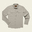 A light beige Emerger Tech Shirt, this longsleeve button-up features a pointed collar, two chest flap pockets, and buttoned cuffs. With UPF 35 protection, it’s laid flat on a cream background with a brown brand label inside the collar.