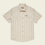 A vintage inspired shirt, this short-sleeve, button-up Howler Brothers features light beige and tan vertical stripes, chest pockets with flaps, pearl snaps, and a pointed collar, laid flat on a neutral background.