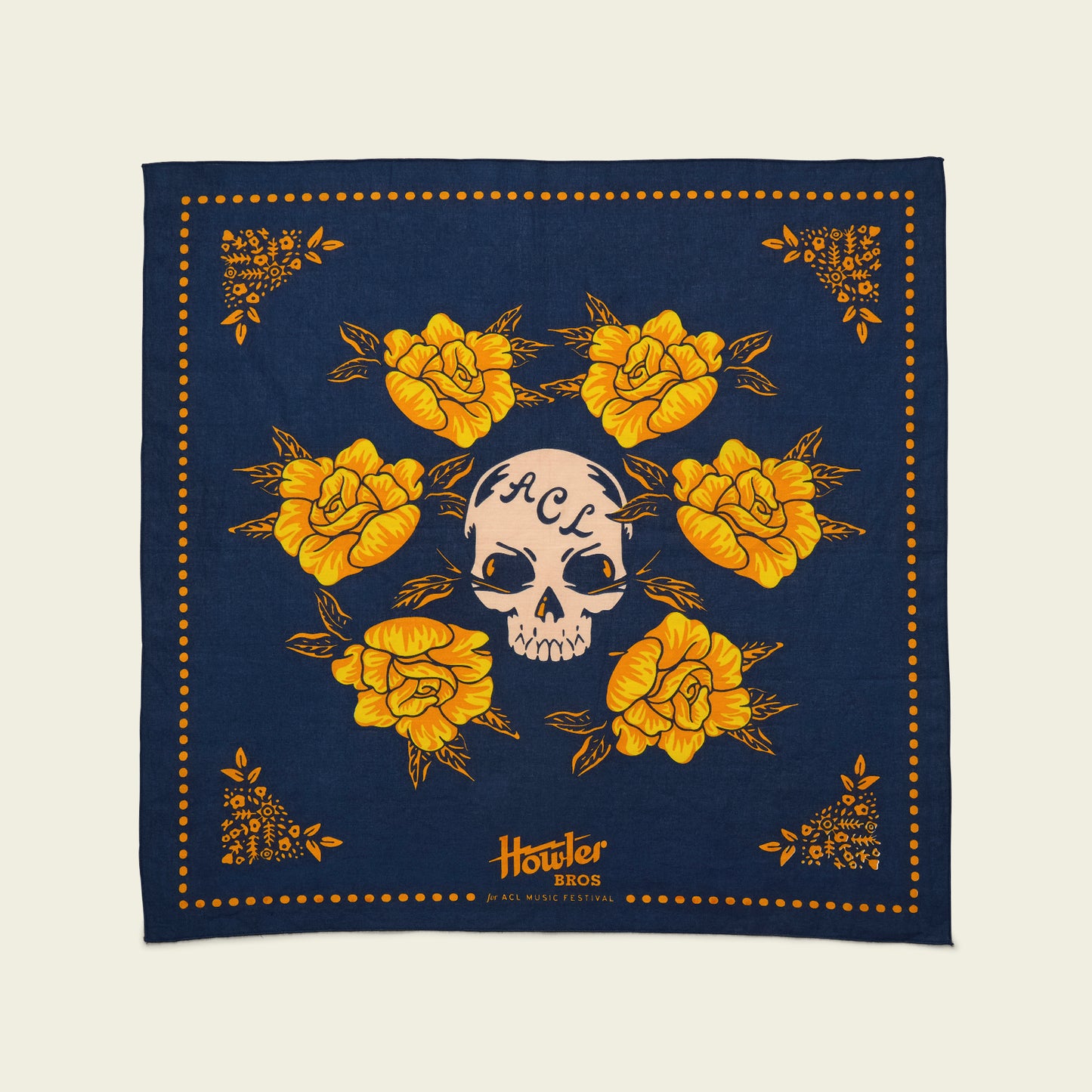 A navy blue Howler Bandana from the Yellow Rose Collection features yellow flowers surrounding a skull with ACL written on its forehead. The bottom center reads Howler Bros ACL Festival Music. - View 4