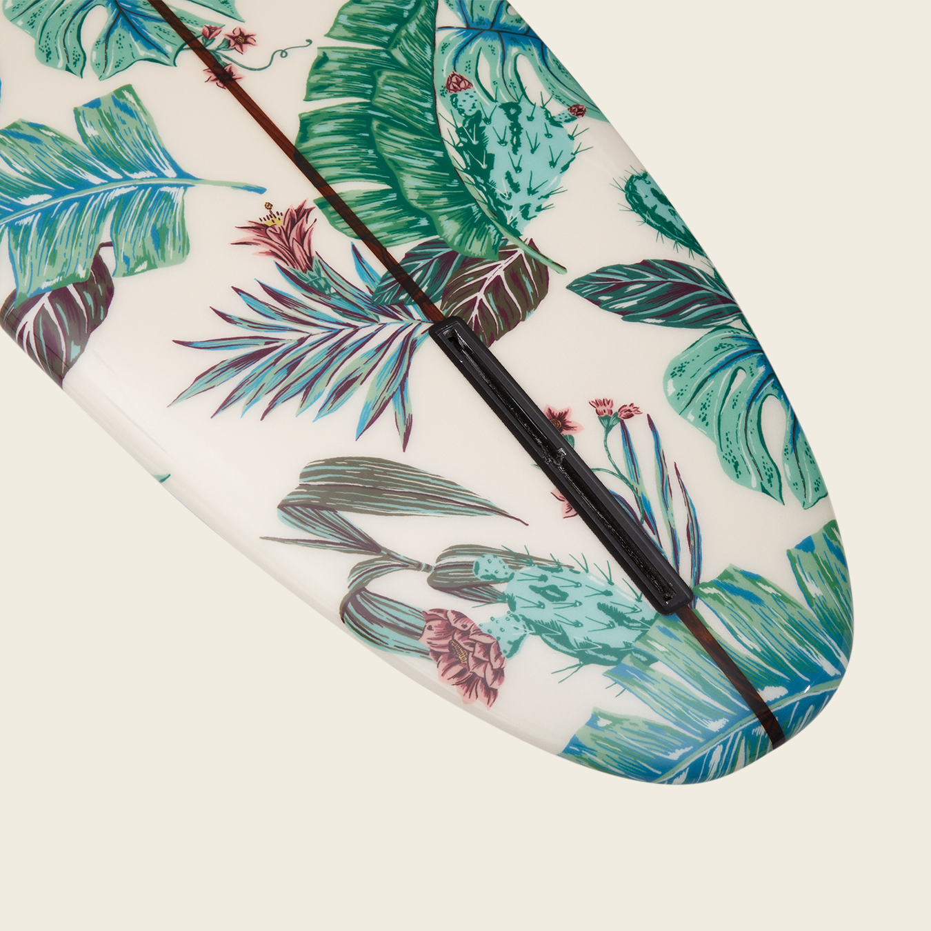 A close-up of a Surf Thump longboard decorated with a vibrant tropical pattern featuring green leaves and colorful flowers on a white background, perfect for those seeking versatile handling on the waves. - View 3