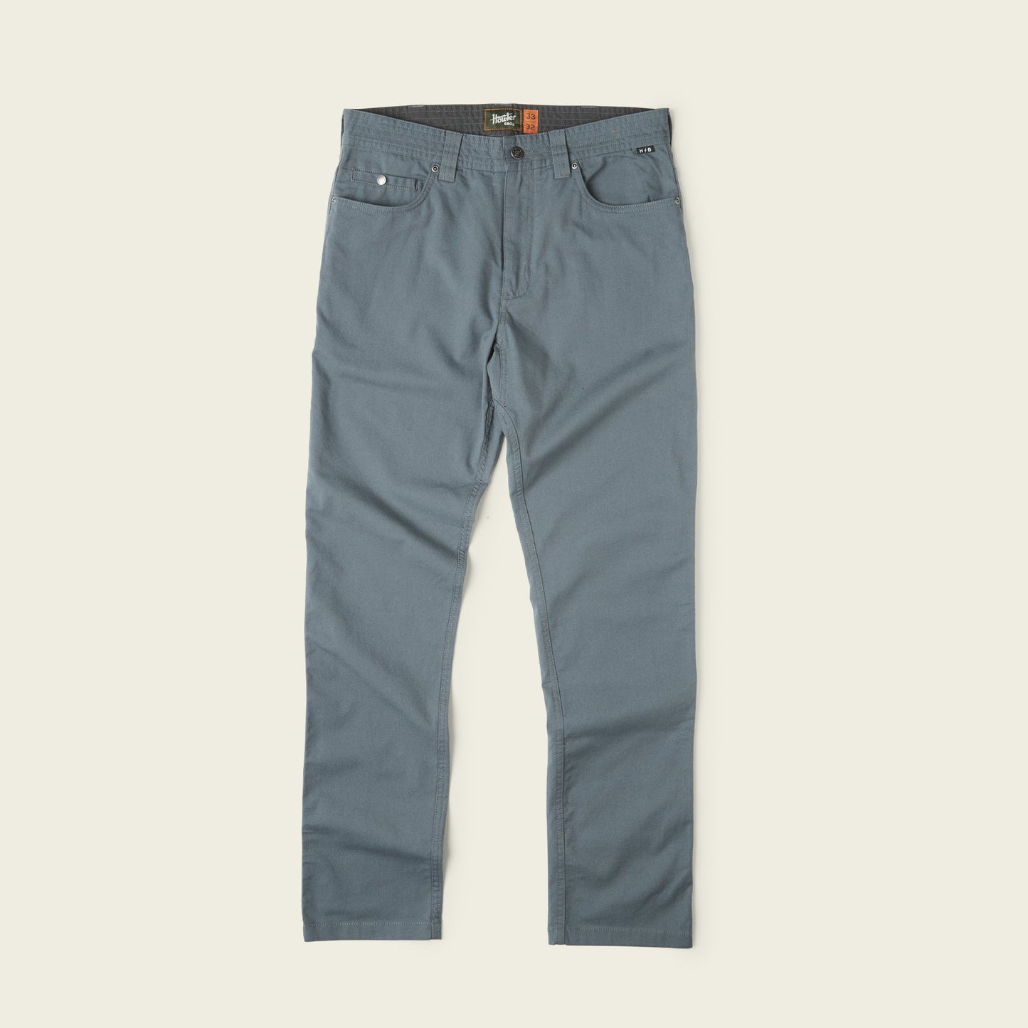 A pair of Frontside 5-Pocket Pant in blue-gray, crafted from durable cotton canvas, laid flat on a light background and featuring straight legs, front and back pockets, and a button at the waist for a versatile look. - View 6