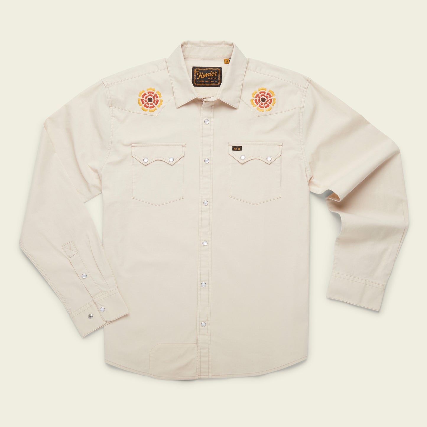 A cream-colored, long-sleeve western shirt crafted from stretch chambray, featuring pearl snaps, two chest pockets, and colorful rose vintage inspired motif embroidery on each shoulder. - View 12