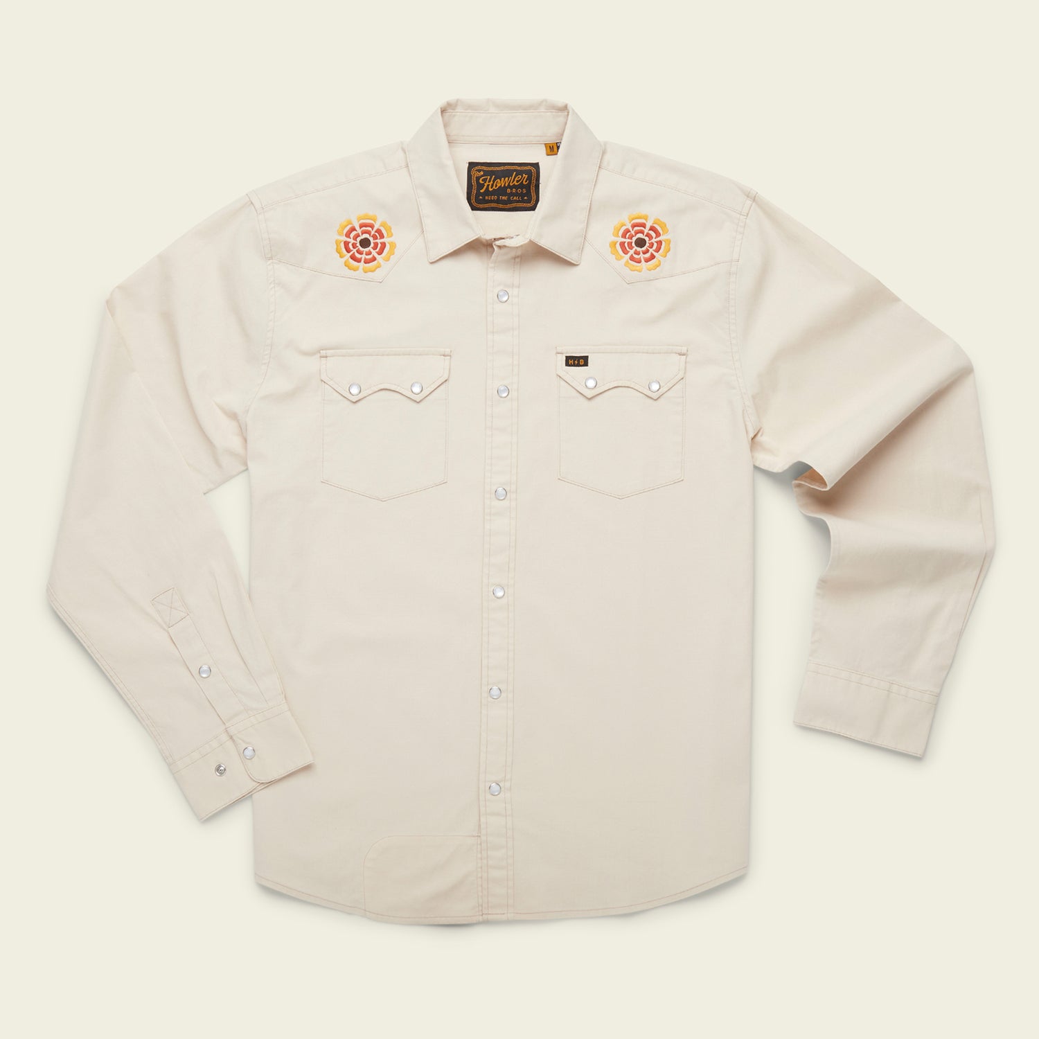 A cream-colored, long-sleeve western shirt crafted from stretch chambray, featuring pearl snaps, two chest pockets, and colorful rose vintage inspired motif embroidery on each shoulder. - View 12