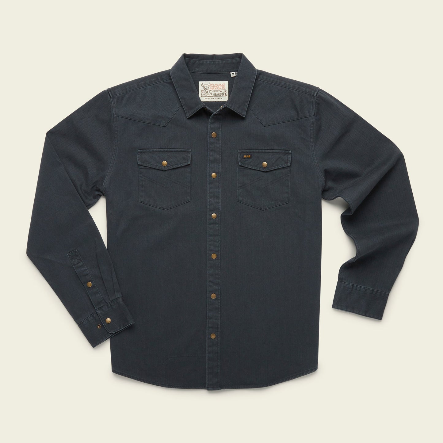 A rugged cotton Sawhorse Work Shirt in dark blue denim with long sleeves, front button closure, two flap chest pockets, and bronze-colored buttons, laid flat on a light background. - View 4