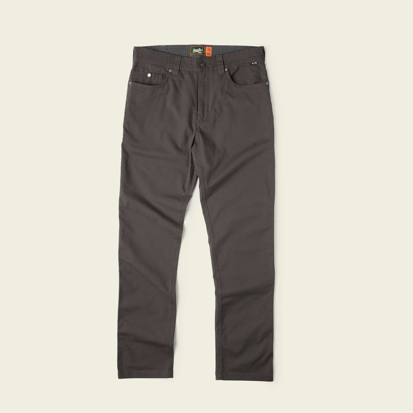Dark brown Frontside 5-Pocket Pant in durable cotton canvas with straight legs, front and back pockets, belt loops, and a button closure, displayed flat against a light beige background—a truly versatile pant for any occasion. - View 2