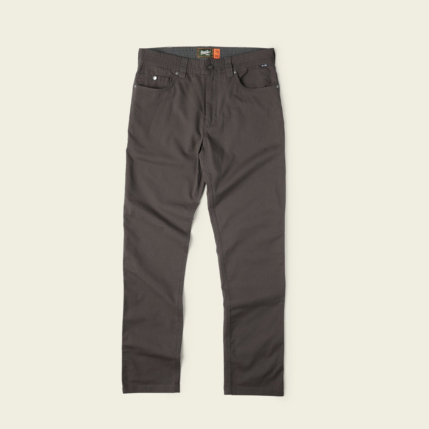 Dark brown Frontside 5-Pocket Pant in durable cotton canvas with straight legs, front and back pockets, belt loops, and a button closure, displayed flat against a light beige background—a truly versatile pant for any occasion. - View 3