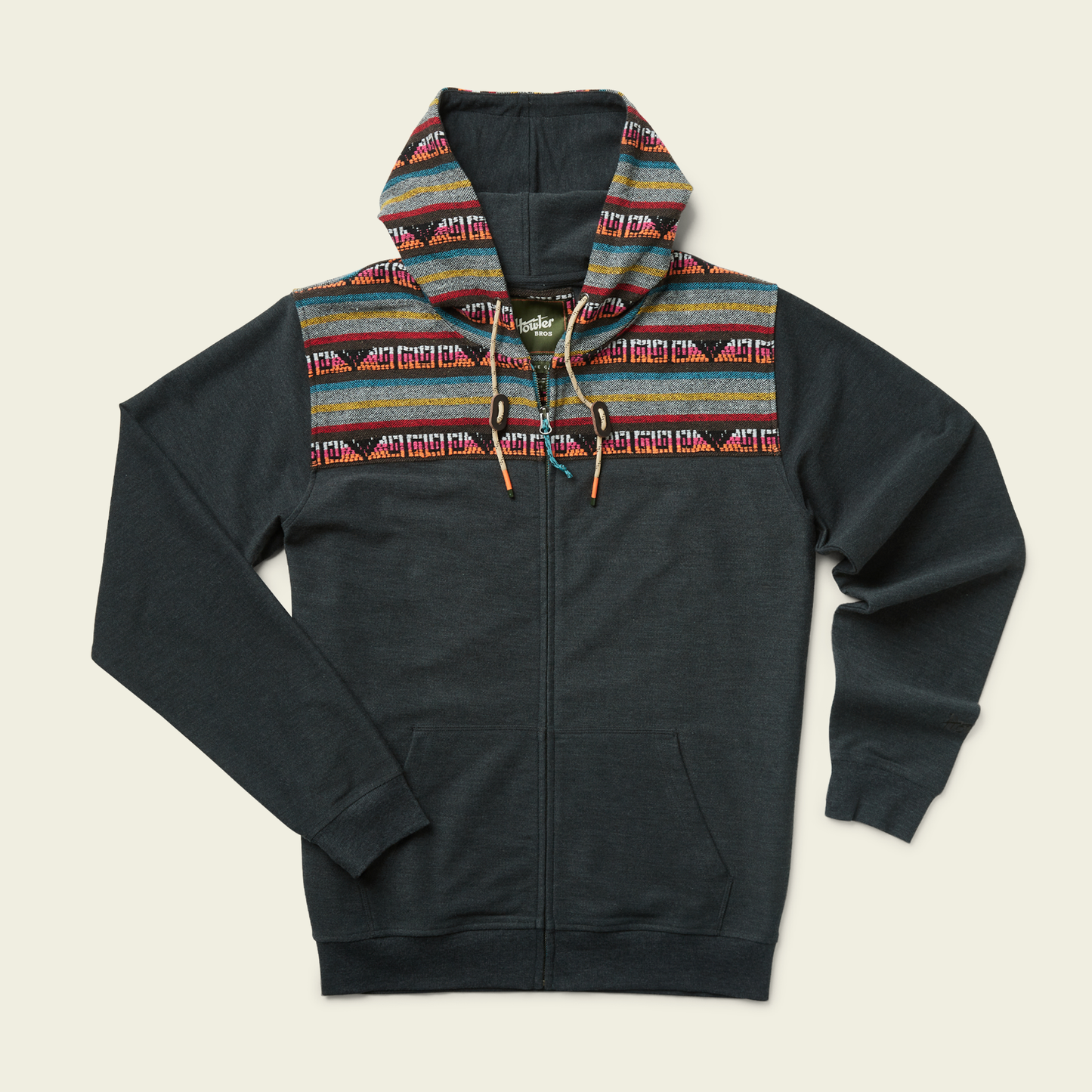 A dark gray cotton blend hoodie with a woven jacquard yoke featuring colorful stripes and geometric designs across the shoulders and hood. The hoodie has long sleeves, front pockets, and vibrant Baja hoodie-inspired patterns. - View 3
