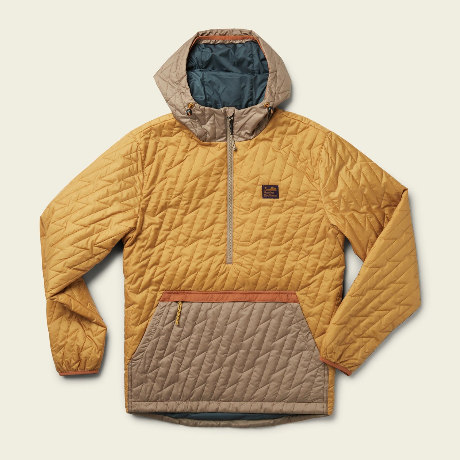A lightweight travel jacket, this quilted pullover features PrimaLoft insulation, a hood, front half-zip, large zippered pocket, and small logo patch. The yellow and beige color-block design is accented with bold orange trim details. - View 7