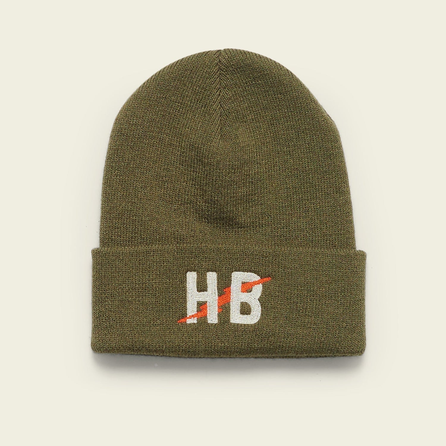 An olive green knit beanie with the letters HB embroidered in white on the front, crossed by a red diagonal line.