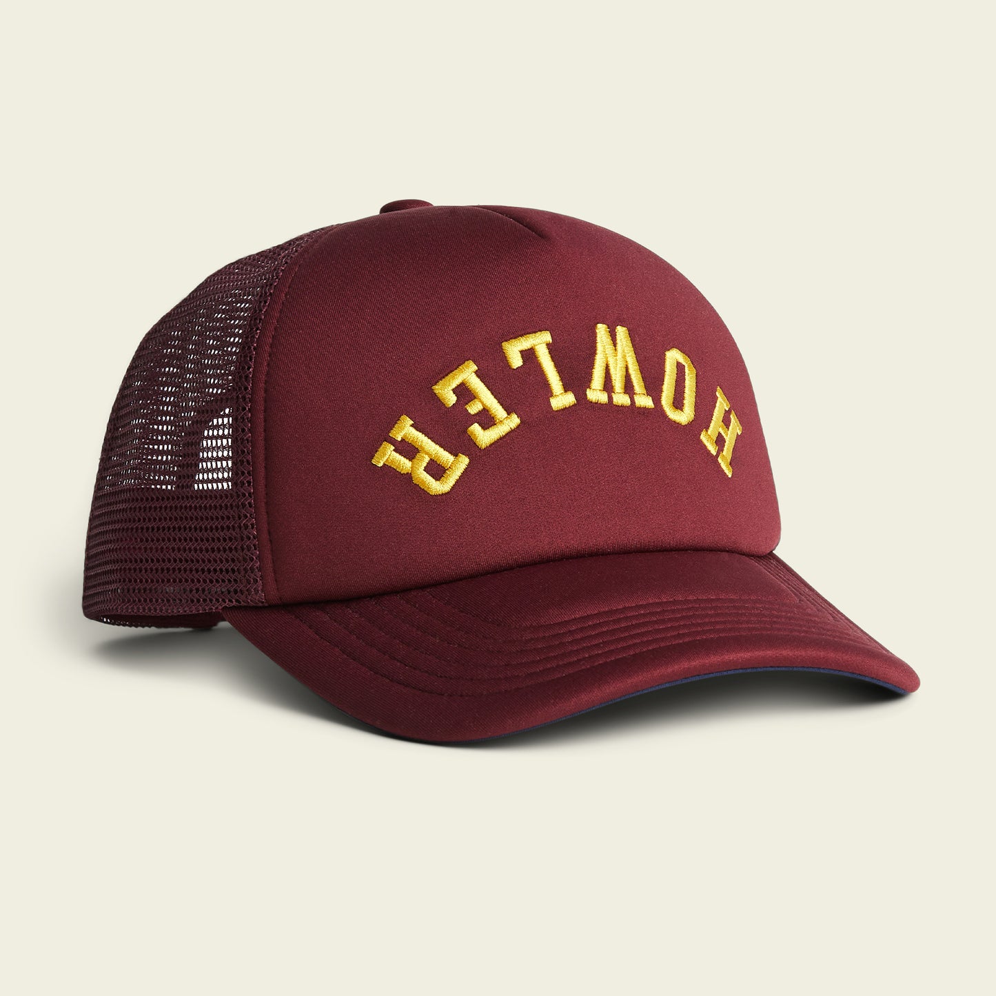 A vintage-inspired, maroon mesh trucker hat with a foam front and the word “HOWLER” embroidered in yellow, upside down, on the high crown front panel. - View 2