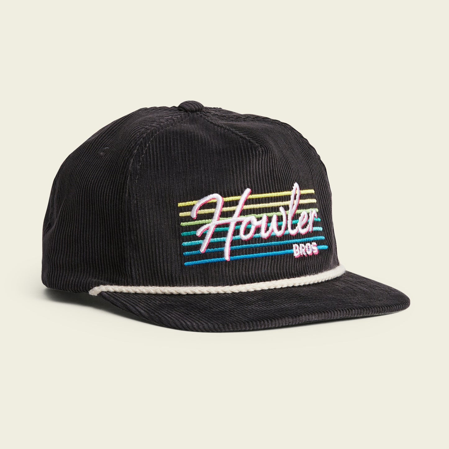 A black corduroy unstructured snapback cap with a soft crown, white braided rope above the brim, and colorful embroidered Howler Bros text in retro-style font on the front, finished with an adjustable snapback closure. - View 1