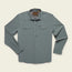 The Emerger Tech Shirt is a lightweight long sleeve, light gray button-up with two chest pockets, buttoned cuffs, and a collar, laid flat on a cream background. Features UPF 35 protection for all-day comfort.