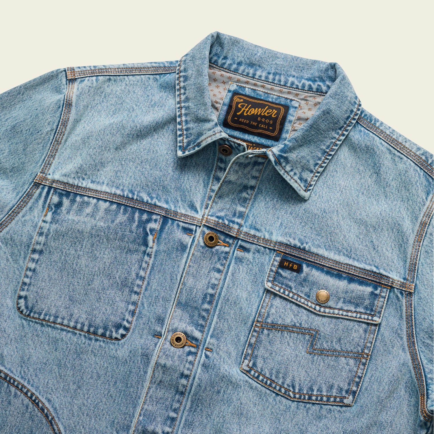 Light blue Depot Jacket denim jacket with large front pockets, button closures, and visible seams. The collar is folded, and a label on the inside reads Homler in yellow text with additional details. - View 7