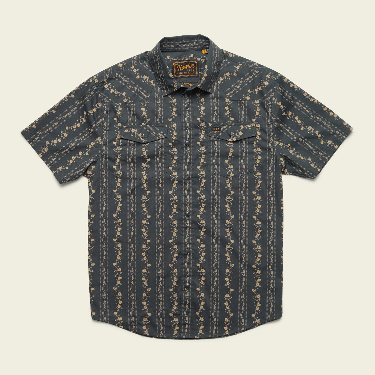 Short-sleeve button-up western shirt with a dark background and vertical floral stripe pattern, featuring two front chest pockets with button flaps and classic pearl snaps. - View 15