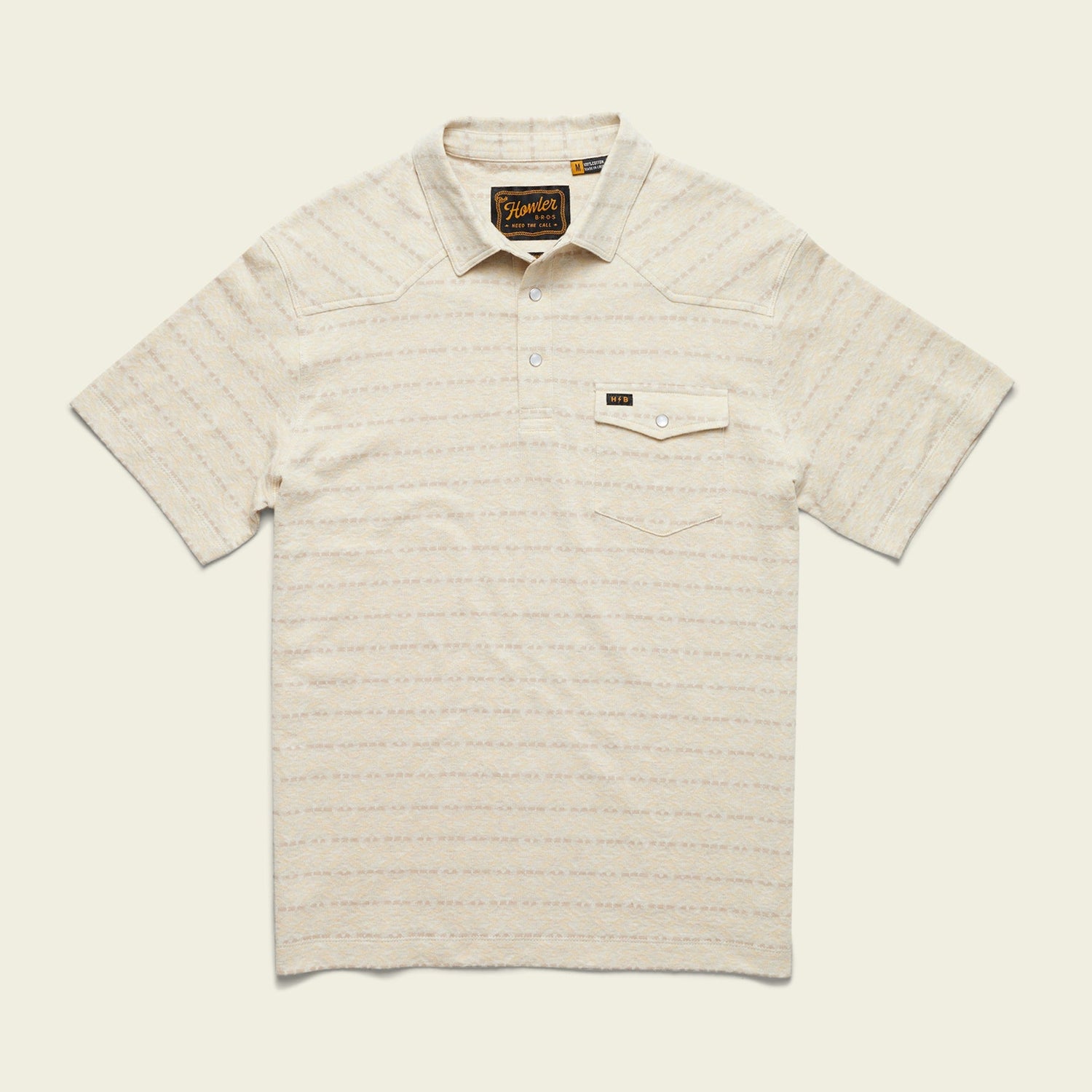 A short-sleeve, light beige Jacquard Polo with subtle horizontal stripes, a buttoned collar, and a chest pocket featuring a small label above the pocket flap. Made from 100% cotton for ultimate comfort.