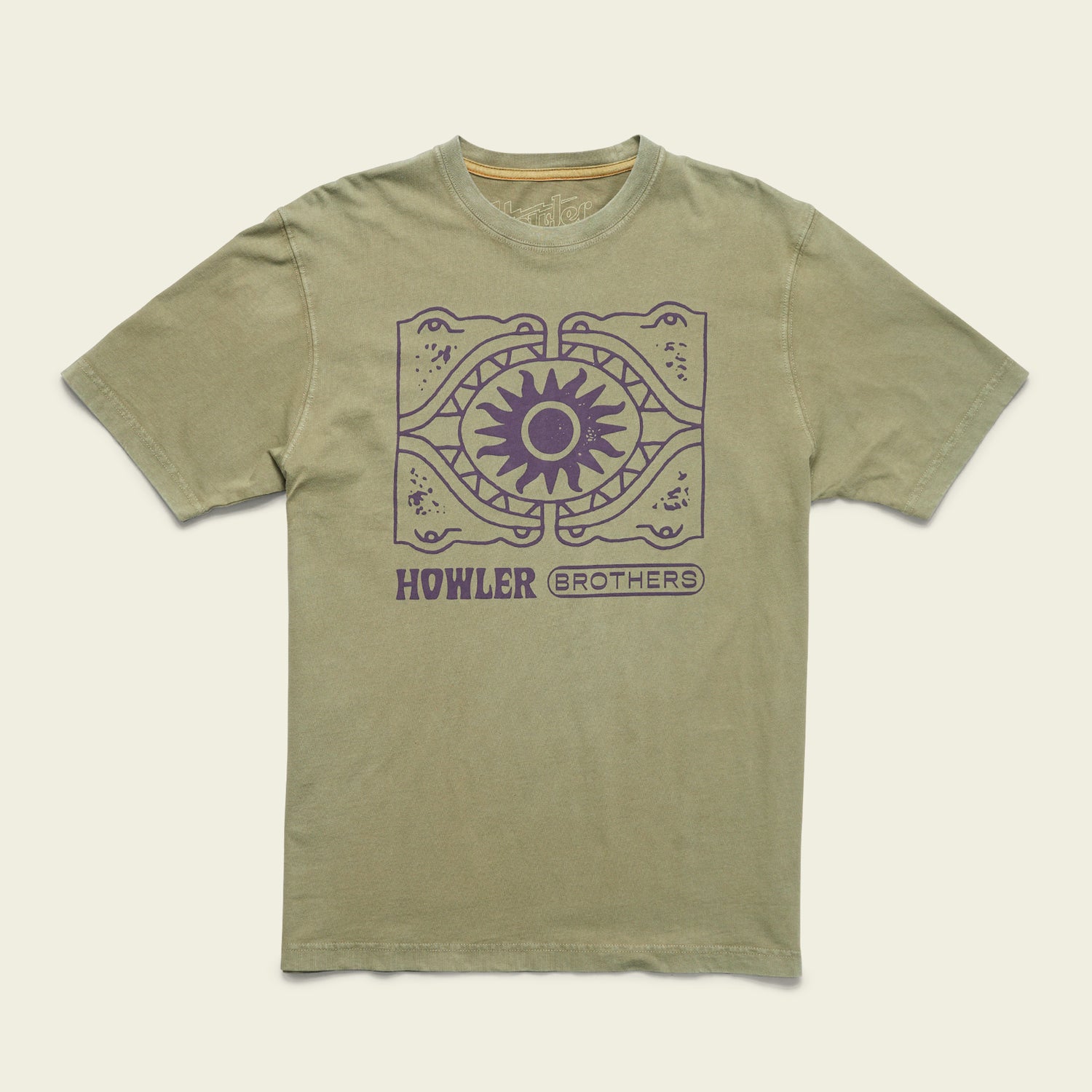 An olive green T-shirt with a purple graphic of two alligators facing each other, forming a circle around a sun design. Reminiscent of vintage t-shirts, HOWLER BROTHERS is printed in bold, purple text below the image.