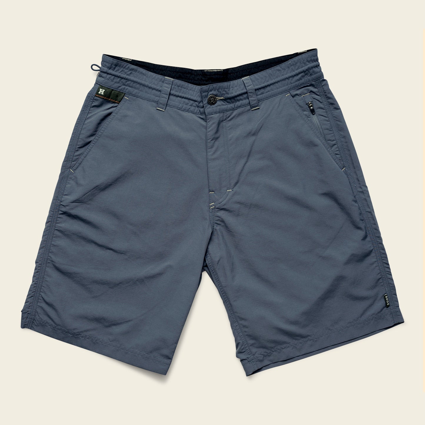 A pair of blue-gray Horizon Hybrid Shorts with front pockets, belt loops, and a zippered pocket on the right side, crafted from durable ripstop fabric and displayed on a plain light background. - View 2