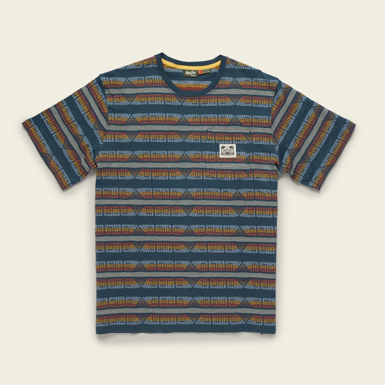 A short-sleeve crew neck jacquard t-shirt made from 100% cotton, featuring a blue, orange, and brown geometric striped pattern and a white rectangular patch on the left chest. - View 6