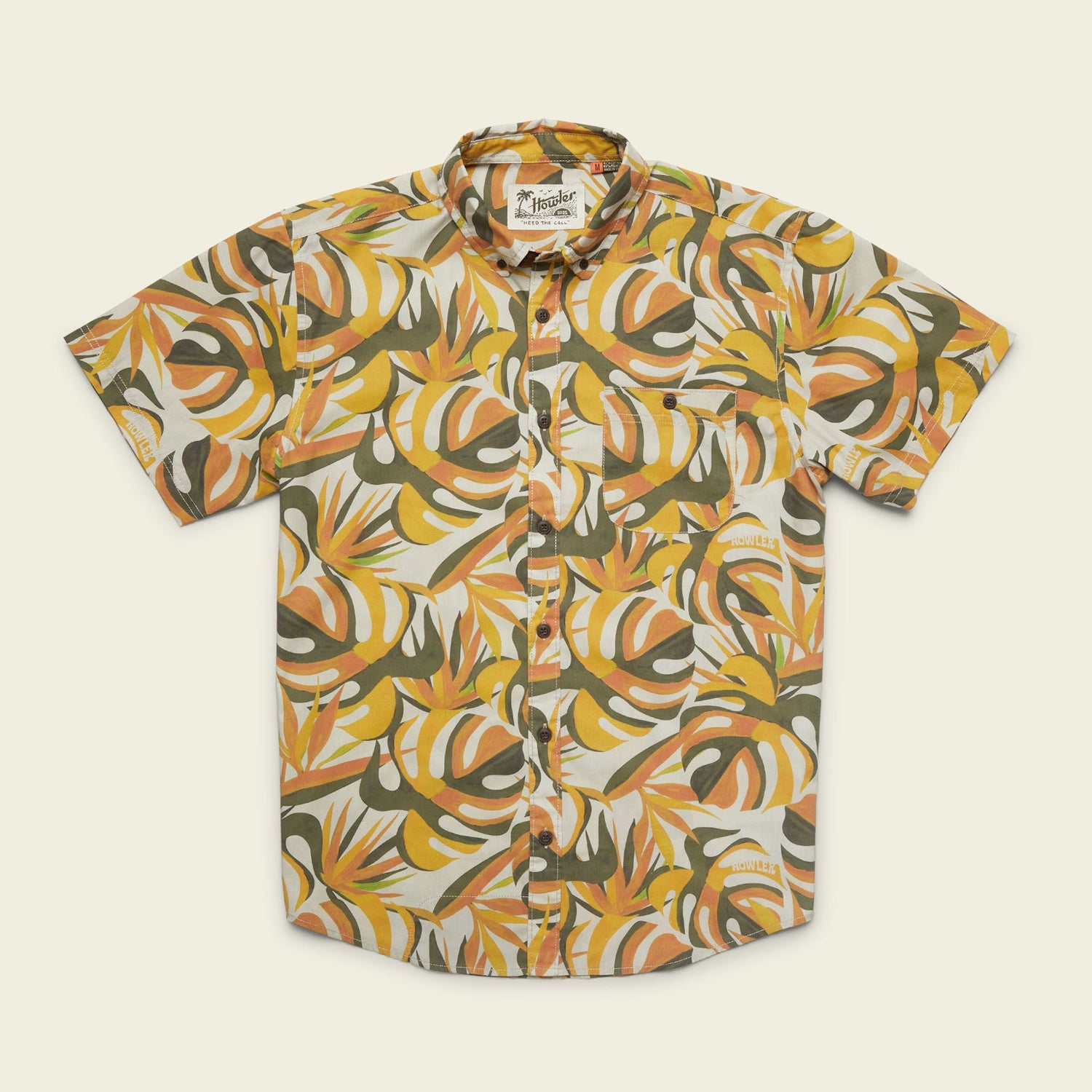 The Mansfield Shirt is a lightweight cotton-poly shirt featuring unique seasonal patterns—a bold, abstract tropical leaf design in orange, yellow, white, and green on a light background. - View 4