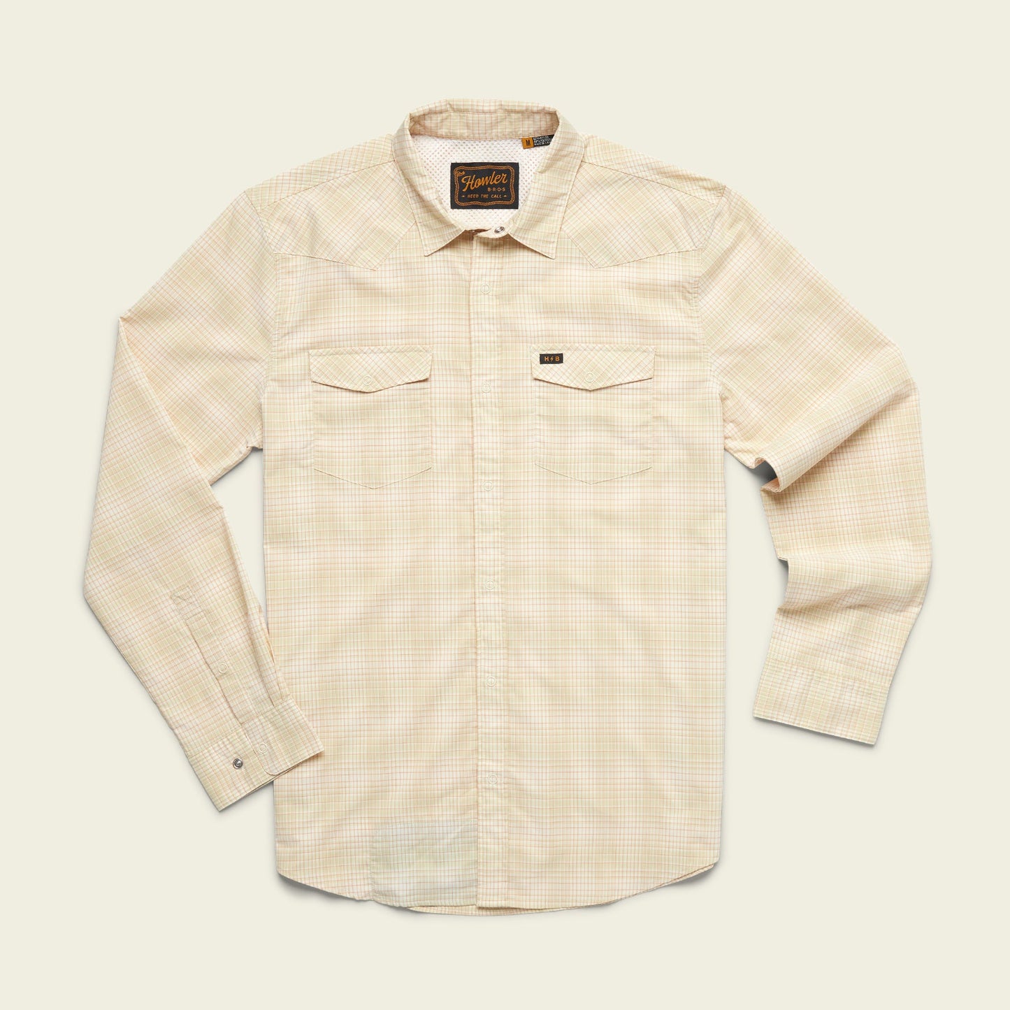 A long-sleeve, light beige plaid lightweight stretch shirt with two chest pockets, a collar, and vented yoke detail, laid flat on a plain off-white background. - View 21