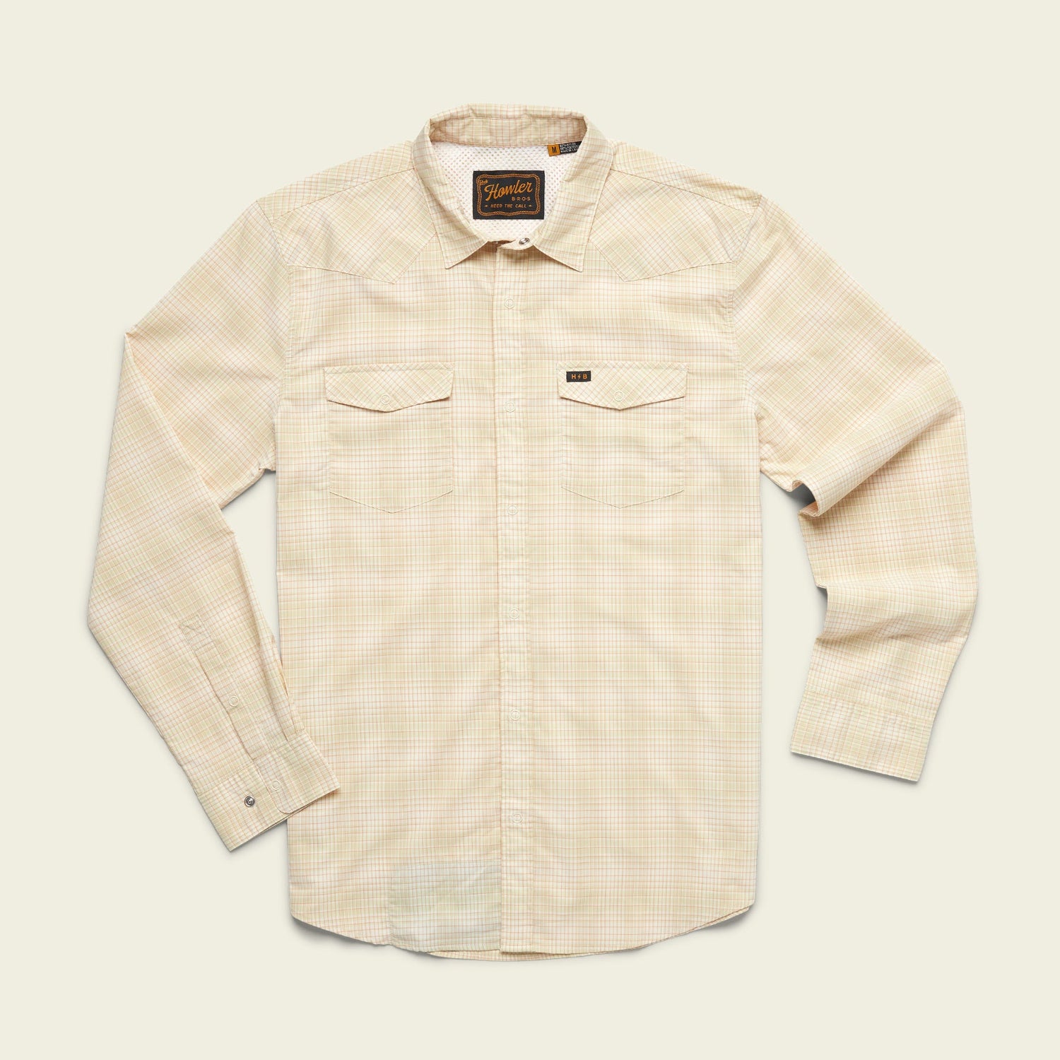 A long-sleeve, light beige plaid lightweight stretch shirt with two chest pockets, a collar, and vented yoke detail, laid flat on a plain off-white background. - View 21