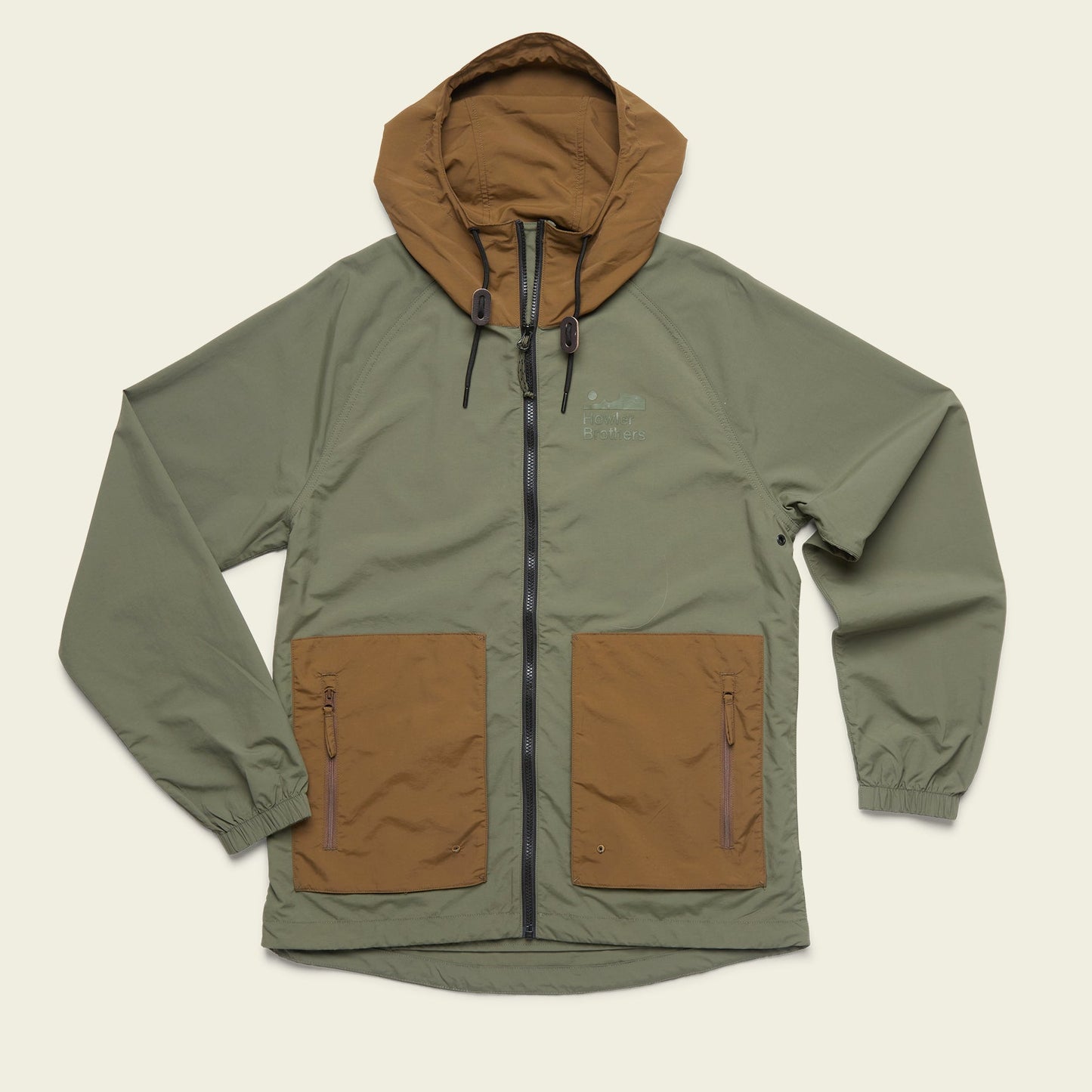 A two-tone Seabreacher Jacket with an olive green body and brown hood and front pockets, featuring a front zipper, drawstrings on the hood, elastic cuffs, and a lightweight windbreaker design that’s also water resistant. - View 1