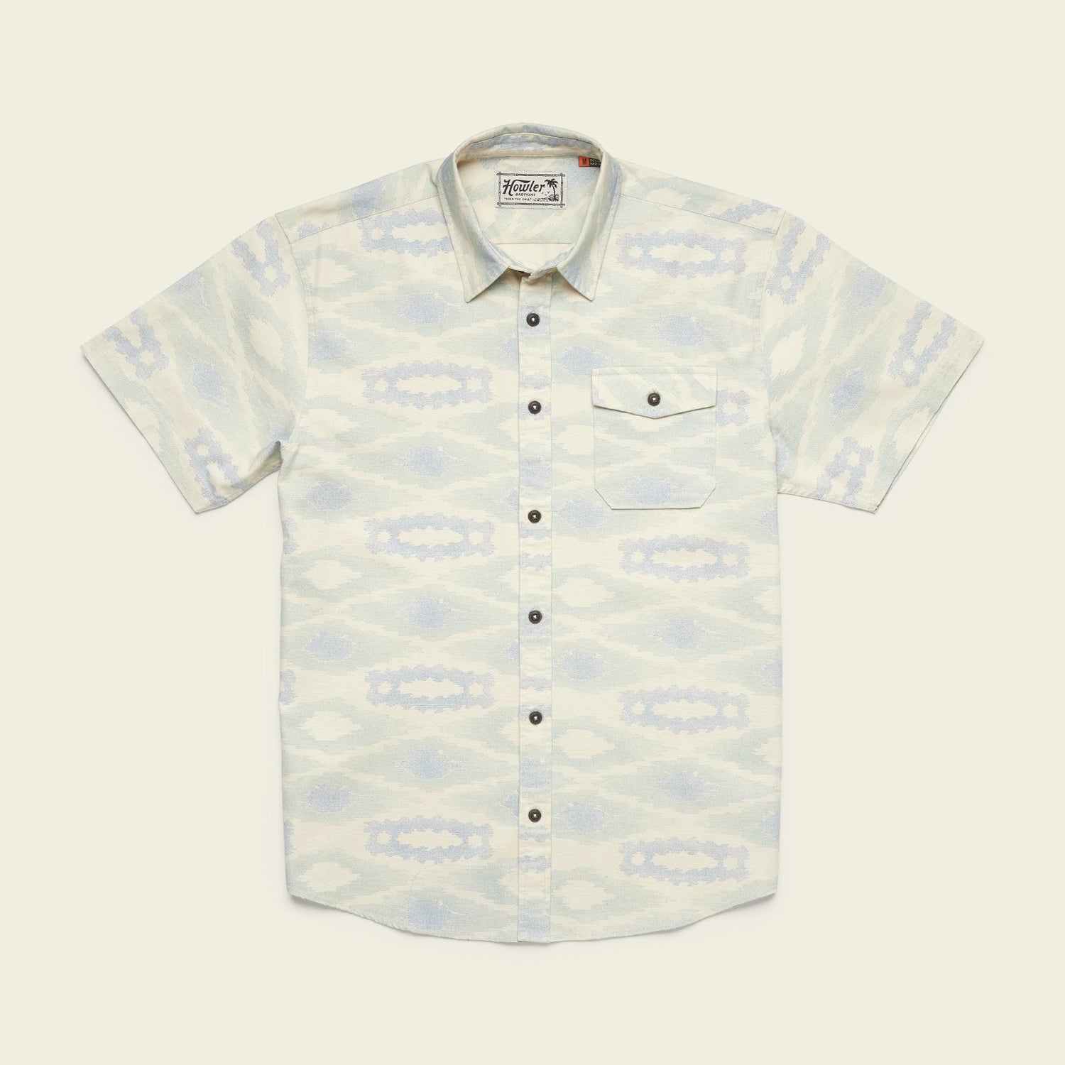 Short-sleeve button-up single pocket shirt with a pale blue and cream southwestern-inspired geometric pattern, crafted from lightweight cotton for comfort, and finished with dark buttons down the front, laid flat on a light background. - View 3