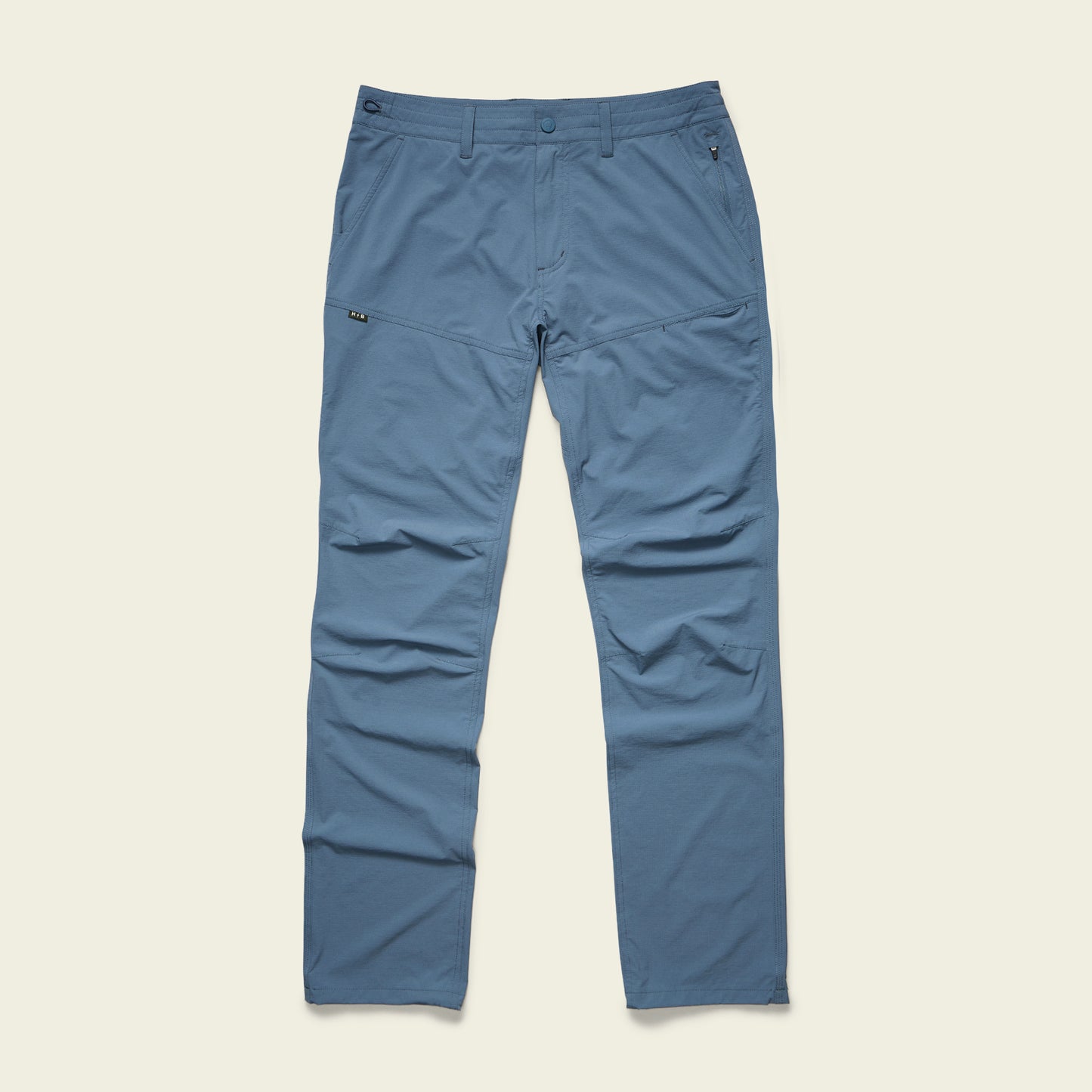 Blue straight-leg Tech Pants with 4-way stretch, front and side pockets, belt loops, and a zip fly, laid flat on a light background. - View 4