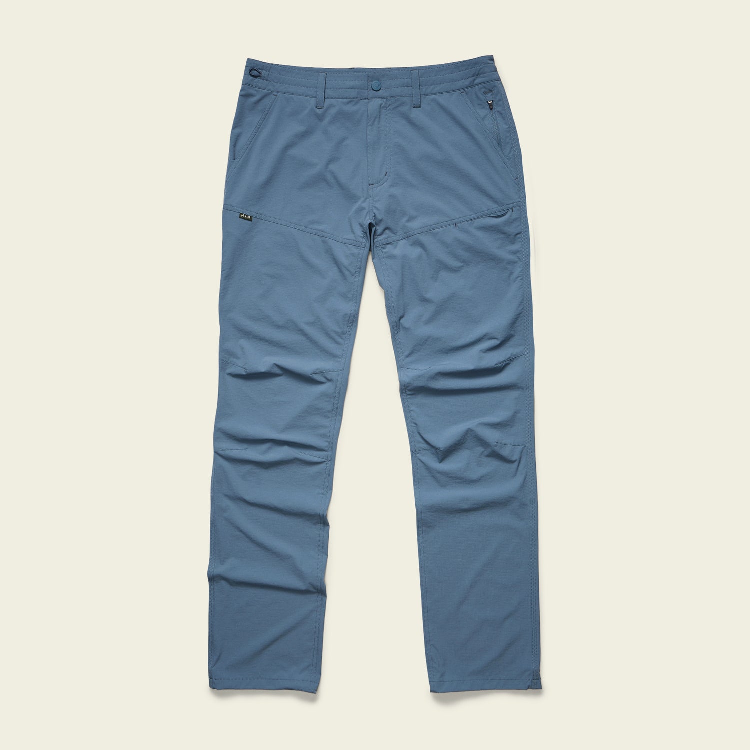 Blue straight-leg Tech Pants with 4-way stretch, front and side pockets, belt loops, and a zip fly, laid flat on a light background. - View 4