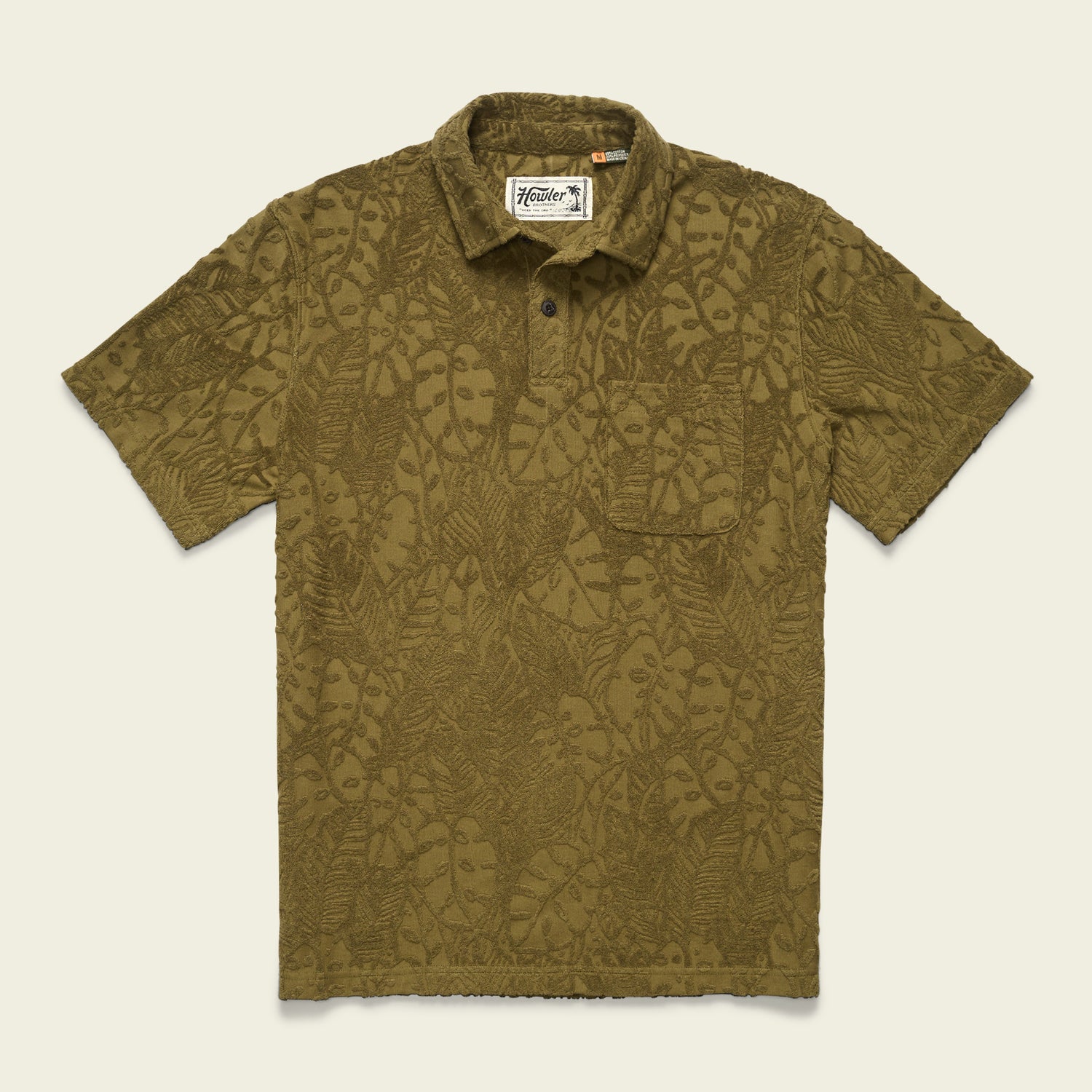 Olive green short-sleeve vintage polo with a textured, leafy tropical pattern, buttoned collar, and a single chest pocket, displayed on a plain light background. - View 3