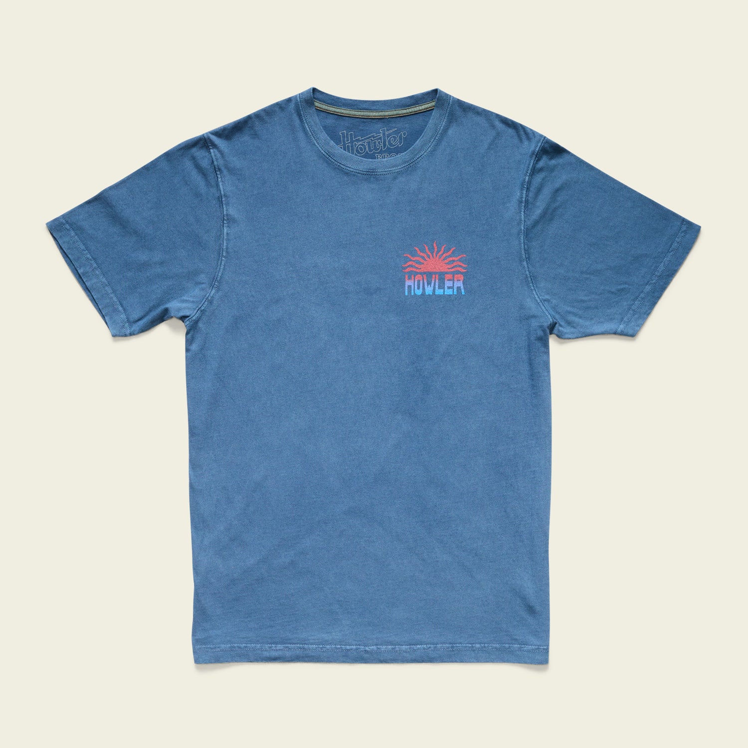 Blue short-sleeve t-shirt with a small, colorful graphic of an orange sun above the word HOWLER on the left chest. Made from resin-washed cotton for a soft, vintage look, it features a relaxed fit and crew neckline. - View 3