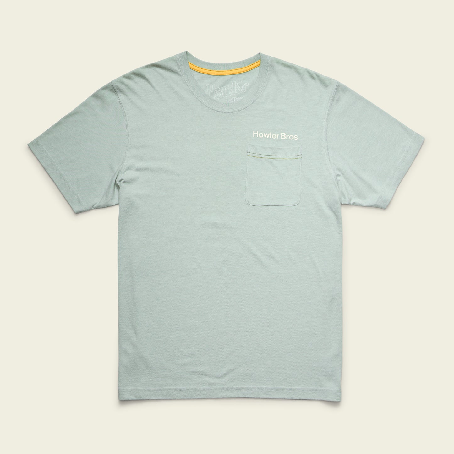 Light blue short-sleeve t-shirt made from a soft cotton-poly blend for maximum comfort, with a chest pocket on the left and Howler Bros text above, displayed on a plain off-white background. - View 3