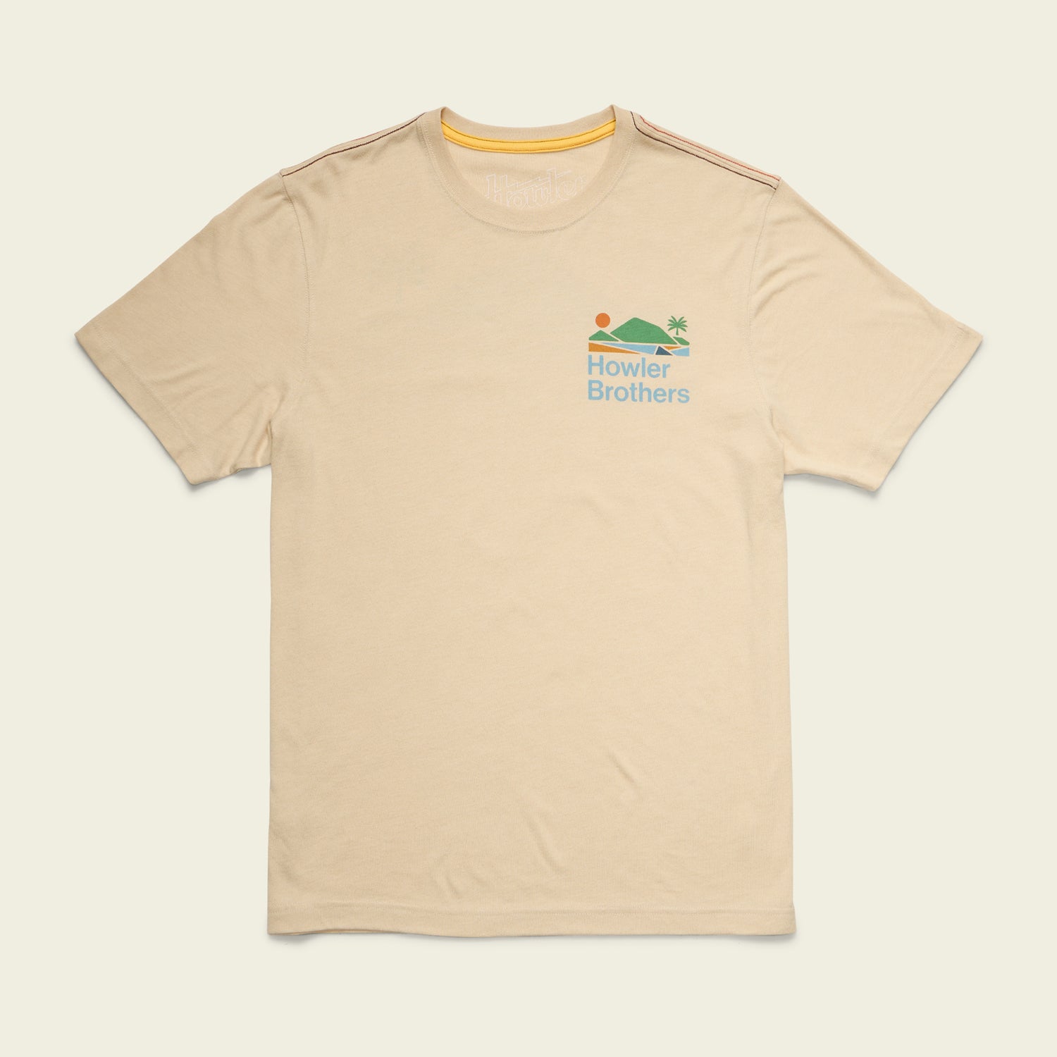 Beige short-sleeve t-shirt with a small colorful graphic of a sun, water, and palm tree above the words Howler Brothers on the left chest. Made from a soft cotton-poly blend for maximum comfort, with subtle orange stripes on the shoulders. - View 3